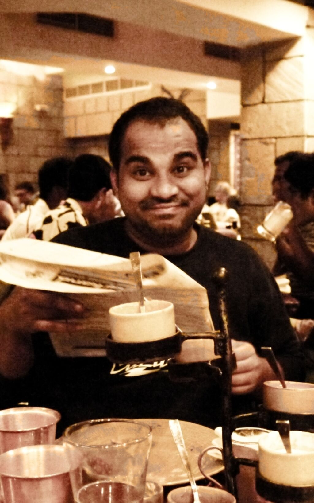 Rao offers the menu with a smile